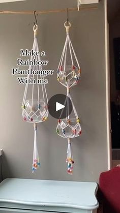 a room with a blue dresser and two hanging glass beads