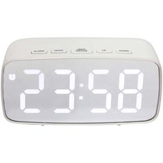 the alarm clock is white and has two large numbers on each side, as well as four