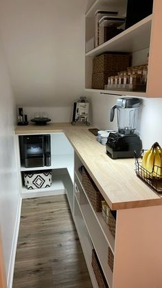 the kitchen is clean and ready to be used as a work space for someone's office