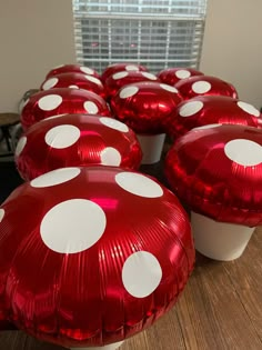 red and white polka dot balloons sitting on top of a table