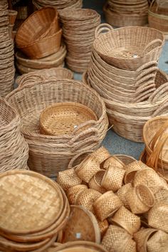 wicker baskets are stacked on top of each other in different sizes and shapes,