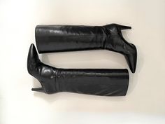 Black MIU MIU leather boots. Knee high, pointed toes, stiletto 3" heels. Excellent condition - only signs of wear are on the bottom soles and back of heels. Does not come with original box, but dust bag for each boot is included. Made in Italy 15.5" shaft height 14" calf circumference 14.75" opening circumference ALL SALES FINAL Returns or exchanges are not accepted Kindly note that vintage items are 20+ years old and are in USED condition unless otherwise noted. While I always ensure that items Leather Boots Knee High, Knee High Stiletto Boots, Boots Knee High, Stiletto Boots, Boots Knee, Boot Shoes Women, Miu Miu, Riding Boots, Halloween Shopping