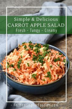 carrot salad in a blue bowl with parsley on top and text overlay that reads, simple & delicious carrot apple salad fresh - tangy - creamy