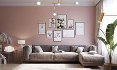 a living room with pink walls and pictures on the wall above the couch, along with other furniture