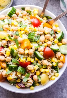 a white bowl filled with couscous and vegetables