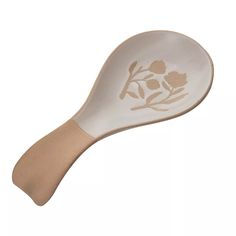 a spoon with flowers etched on it