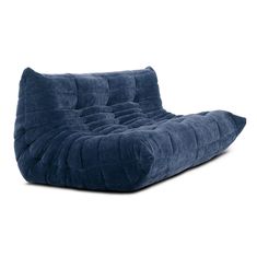 a blue couch sitting on top of a white floor