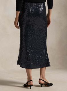 Cut on the bias for a fluid A-line silhouette, this midi-length skirt is created by embroidering shimmering sequins on stretch mesh. Mesh Midi Skirt, Sequin Midi Skirt, India Dress, Preppy Lifestyle, Stretch Skirt, Ralph Lauren Polo Shirts, Mesh Skirt, Midi Length Skirts, Dress Shapes