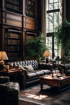 a living room filled with furniture and lots of bookshelves next to a window