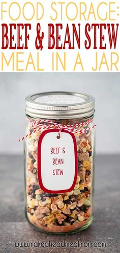 a jar filled with food sitting on top of a table next to a red and white tag