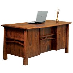 a wooden desk with a laptop on it