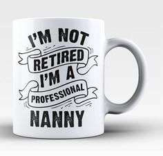 a white coffee mug with the words i'm not retired, i'm a professional grandma