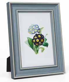 a blue frame holding a painting of flowers in it's center, with green leaves and yellow centers