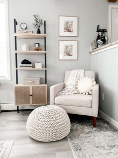 a living room filled with furniture and decor on top of a hard wood floored floor