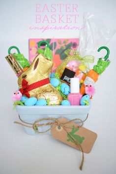 an easter basket with chocolate eggs and candy