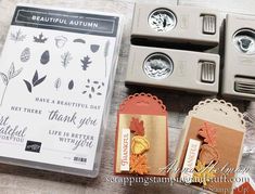 stamping supplies are laying on the table next to each other, including stamps and paper