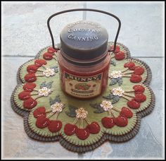 a jar of jam sitting on top of a rug