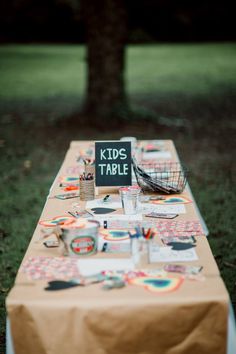 a long table covered in lots of different items