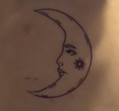 a drawing of a woman's face on the moon