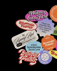 many different colored stickers on a black background with the words women's first and brownie points