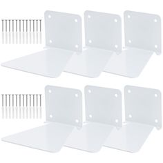 four white plastic shelf brackets with screws on each side and two rows of pins at the bottom