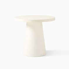 a white table with a round top on a white background