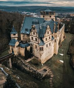 an aerial view of a castle with stairs leading up to it