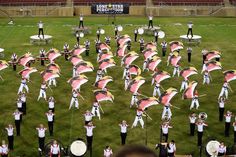 a marching band is performing on the field