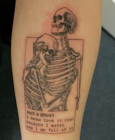 a skeleton with a quote on its arm