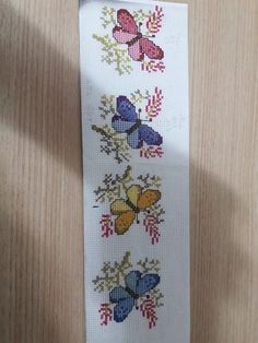 a white ribbon with colorful butterflies on it