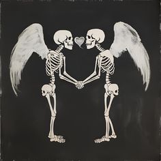 two skeletons holding hands with white wings and a heart in the middle on a black background