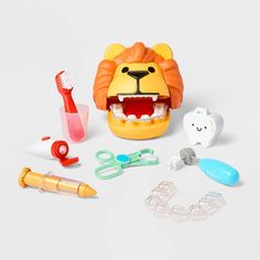 an assortment of toys including toothbrushes, scissors and teethpaste