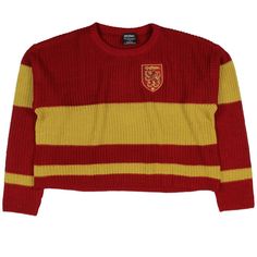 a red and yellow striped sweater with a crest on the chest