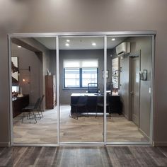 an open glass door leading to a living room