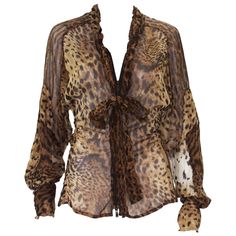 Tom Ford for Yves Saint Laurent Leopard Silk Top Blouse Fr. size - 38 S/S 2002 Collection 100% Sheer Silk, Leopard Print, Front Zip Closure Attached Ruffled Tie, Long Raglan Sleeves. Measurements: Length - 25 inches, Bust - 32, Waist - up to 27. Made in France Excellent Condition. Silk Tops Blouses, Gender Fluid Fashion, Leopard Blouse, Brown Blouse, Future Outfit, Leopard Print Top, Vintage Fits, Leopard Print Blouse, Brown Leopard