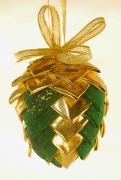 an ornament shaped like a pineapple hanging from a string