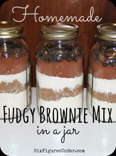 three jars filled with food sitting on top of a table