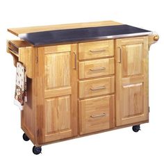 a kitchen island with a black top on wheels