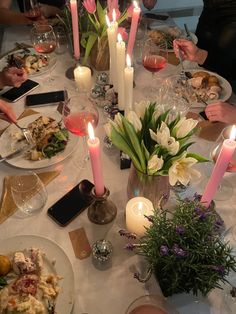 a group of people sitting around a dinner table