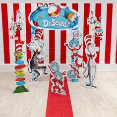 dr seuss themed birthday party with cat in the hat paper cutouts and decorations