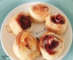 small pastries on a plate with the word sweet written below them in cursive writing