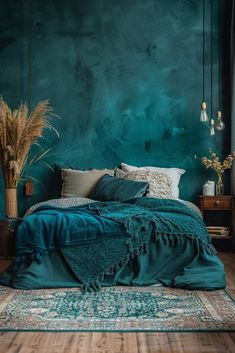 a bedroom with teal green walls and wooden flooring is pictured in this image