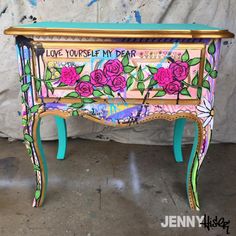 a painted table with flowers on it and words written on the top that says love yourself my dear