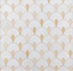 an art deco wallpaper with gold and white scallops on the back side