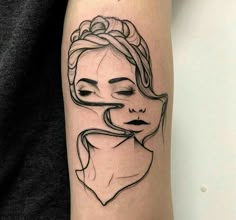 a woman's face with her eyes closed and hair blowing in the wind tattoo