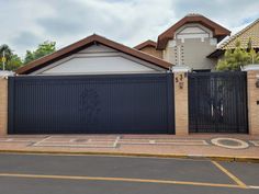 a house with a black gate in front of it