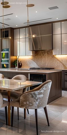 a modern kitchen and dining room with marble flooring