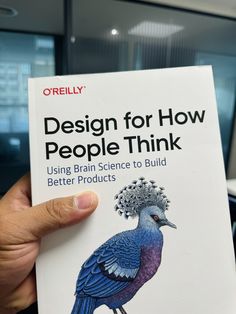 a person holding up a book in their hand that says design for how people think using brain science to build better products