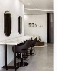 the salon is clean and ready for customers to take their own seat at the counter