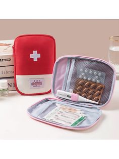 an open first aid kit sitting on top of a table